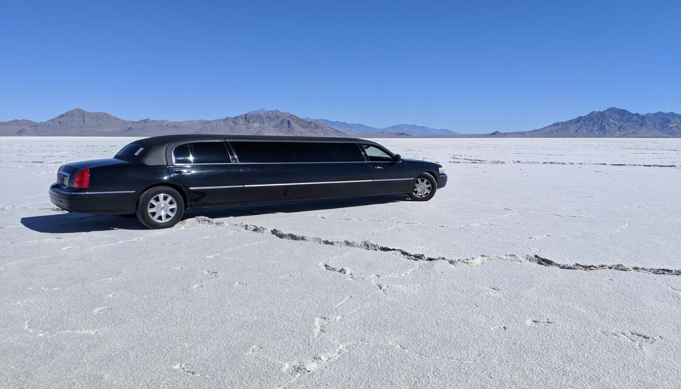 Sleek black limousine parked outdoors